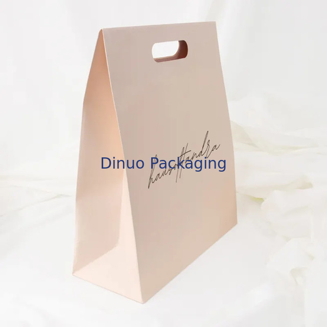 Imballaggio di abbigliamento Manicotto a taglio a stampaggio Acquisti Borsa di carta Kraft Borse regalo gialle personalizzate