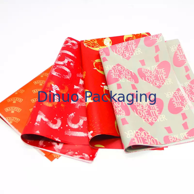 Confezione regalo di Natale Confezione di carta velina rossa con stampa floreale in lamina d'oro